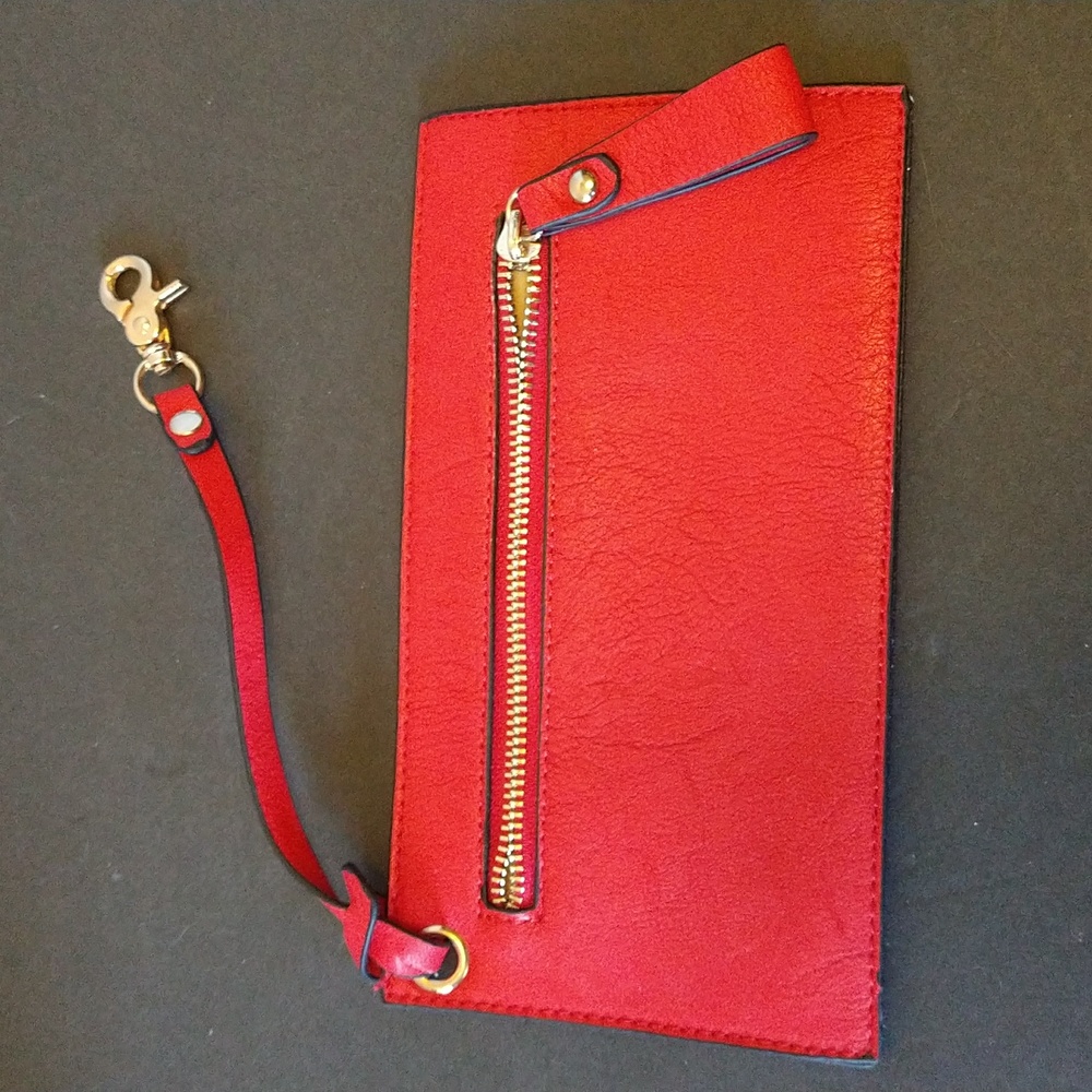 NWOT. Red wristlet with gold embellishments.